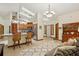 Open kitchen with an island, stainless steel appliances, and plenty of natural light streaming through skylights at 2180 Captain Dr, Deltona, FL 32738