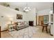 Inviting living room boasts neutral tones, plush seating, and stylish decor under a decorative chandelier at 2180 Captain Dr, Deltona, FL 32738