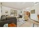 Inviting living room with a neutral color palette, tile flooring, and sunlit windows at 2180 Captain Dr, Deltona, FL 32738