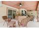 Spacious covered patio features outdoor bar with seating, perfect for entertaining guests at 2180 Captain Dr, Deltona, FL 32738