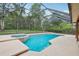Relaxing screened-in pool with attached spa provides the perfect outdoor retreat at 2180 Captain Dr, Deltona, FL 32738