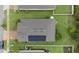 Aerial view showcasing the home's roof, solar panels, manicured lawn, and proximity to neighboring houses at 2339 Jernigan Loop, Kissimmee, FL 34746