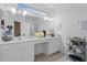 Bright bathroom featuring dual sinks, vanity area, and ample countertop space at 2339 Jernigan Loop, Kissimmee, FL 34746