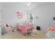 Bright bedroom features a whimsical design with a rocking horse and charming decor at 2339 Jernigan Loop, Kissimmee, FL 34746