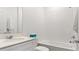 Clean bathroom with white tile, a modern vanity, and a combined shower and bathtub at 2895 Haze Rd, Clermont, FL 34714
