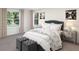 Bright bedroom with large windows, a comfortable bed, stylish décor, and ample natural light at 3021 Namaste Dr, Clermont, FL 34714