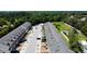 Aerial view of the community showing the layout of townhomes, parking, and surrounding green spaces at 3118 Crown Jewel Ct, Winter Park, FL 32792