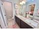 Bathroom featuring double sinks, granite countertops, and a modern design at 3118 Crown Jewel Ct, Winter Park, FL 32792