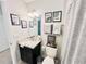 Bathroom with granite countertop, grey shower curtain, and decorative wall art at 3118 Crown Jewel Ct, Winter Park, FL 32792