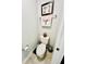 Powder room featuring a toilet, towel rack, and decorative accents at 3118 Crown Jewel Ct, Winter Park, FL 32792