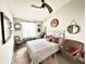Cozy bedroom with light walls, vaulted ceiling, ceiling fan and unique decorative items at 3118 Crown Jewel Ct, Winter Park, FL 32792