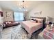 Bright bedroom with neutral walls, wood floors, and a modern chandelier at 3118 Crown Jewel Ct, Winter Park, FL 32792