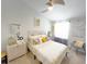 Bright bedroom featuring a ceiling fan, neutral walls, and stylish decor and furnishings at 3118 Crown Jewel Ct, Winter Park, FL 32792