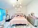 A bedroom featuring a modern chandelier, and neutral walls at 3118 Crown Jewel Ct, Winter Park, FL 32792