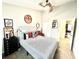 Bedroom with ceiling fan, closet, neutral walls and view into living area at 3118 Crown Jewel Ct, Winter Park, FL 32792