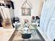 Modern dining area with a glass-top table and stylish chairs, complemented by contemporary lighting at 3118 Crown Jewel Ct, Winter Park, FL 32792