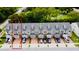 Exterior view of the townhome property showcasing the well-maintained facades and paved driveways at 3118 Crown Jewel Ct, Winter Park, FL 32792
