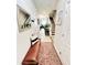 Inviting entryway featuring a cozy bench, stylish rug, and staircase, offering a warm welcome into the home at 3118 Crown Jewel Ct, Winter Park, FL 32792