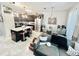 Modern kitchen open to the living room, featuring a large island, stainless steel appliances, and stylish finishes at 3118 Crown Jewel Ct, Winter Park, FL 32792