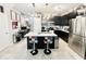 Spacious kitchen with a large island, modern appliances, and stylish barstools, perfect for casual dining at 3118 Crown Jewel Ct, Winter Park, FL 32792