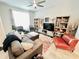 Comfortable living room with a sectional sofa, modern decor, and ample natural light, perfect for relaxation at 3118 Crown Jewel Ct, Winter Park, FL 32792