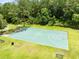 Well-maintained basketball court surrounded by lush greenery, benches and trails, offering a relaxing outdoor space at 3224 Holland Dr, Orlando, FL 32825