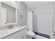 Bathroom with modern white vanity, updated subway tile shower, and sleek fixtures at 3224 Holland Dr, Orlando, FL 32825