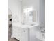 Bathroom featuring white vanity, dual sinks with modern fixtures, and bright lighting at 3224 Holland Dr, Orlando, FL 32825