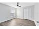 Bedroom featuring neutral walls, modern ceiling fan, and new luxury vinyl flooring with closet at 3224 Holland Dr, Orlando, FL 32825