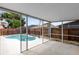 Covered and screened patio with view of the pool and backyard at 3224 Holland Dr, Orlando, FL 32825