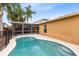 Relaxing pool featuring palm trees and a screened-in lanai, perfect for outdoor living at 3224 Holland Dr, Orlando, FL 32825