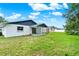 Spacious backyard featuring a covered patio and plenty of green space at 324 James Pl, St Cloud, FL 34769