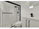 Modern bathroom design with white subway tile shower and sleek black hardware at 324 James Pl, St Cloud, FL 34769