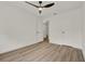 Cozy bedroom featuring wood-look floors, a closet, and a modern ceiling fan at 324 James Pl, St Cloud, FL 34769