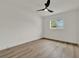 Bright bedroom featuring modern ceiling fan and wood-look flooring at 324 James Pl, St Cloud, FL 34769