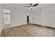 Spacious bedroom with wood-look flooring, a walk-in closet, and an attached bathroom at 324 James Pl, St Cloud, FL 34769