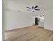 Open living room featuring hardwood floors, an open floor plan, and modern recessed lighting at 324 James Pl, St Cloud, FL 34769