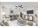 Spacious living room featuring hardwood floors, modern furnishings, and a dining area at 324 James Pl, St Cloud, FL 34769