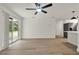 Bright living room with hardwood floors and sliding glass doors that provides ample natural light at 324 James Pl, St Cloud, FL 34769