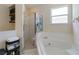 Bathroom featuring a glass-enclosed shower and luxurious soaking tub at 3250 Sawgrass Creek Cir, St Cloud, FL 34772