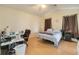 Bright bedroom with wood floors and generous natural light at 3250 Sawgrass Creek Cir, St Cloud, FL 34772