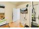 Bedroom with a TV on the wall and a door to an adjacent room at 3250 Sawgrass Creek Cir, St Cloud, FL 34772