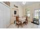 Cozy dining area with tile floors, chalkboard, and view to the backyard at 3250 Sawgrass Creek Cir, St Cloud, FL 34772