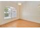 Dining area featuring modern chandelier, bright space, and wood-look floors at 3250 Sawgrass Creek Cir, St Cloud, FL 34772