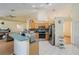 Open kitchen with modern appliances, tile backsplash, and breakfast bar at 3250 Sawgrass Creek Cir, St Cloud, FL 34772
