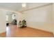 Living room features vaulted ceilings, wood floors, and view to adjacent room at 3250 Sawgrass Creek Cir, St Cloud, FL 34772