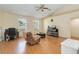 Comfortable living room featuring wood floors, vaulted ceilings and large windows at 3250 Sawgrass Creek Cir, St Cloud, FL 34772