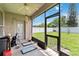 Enclosed patio with view of a green yard and white vinyl fence at 3250 Sawgrass Creek Cir, St Cloud, FL 34772