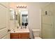 Standard bathroom featuring a single sink, toilet, and glass-enclosed shower with a showerhead at 335 Lansbrook Ln, Winter Springs, FL 32708