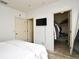 Bedroom with wood floors, white walls, and walk-in closet with door open at 335 Lansbrook Ln, Winter Springs, FL 32708